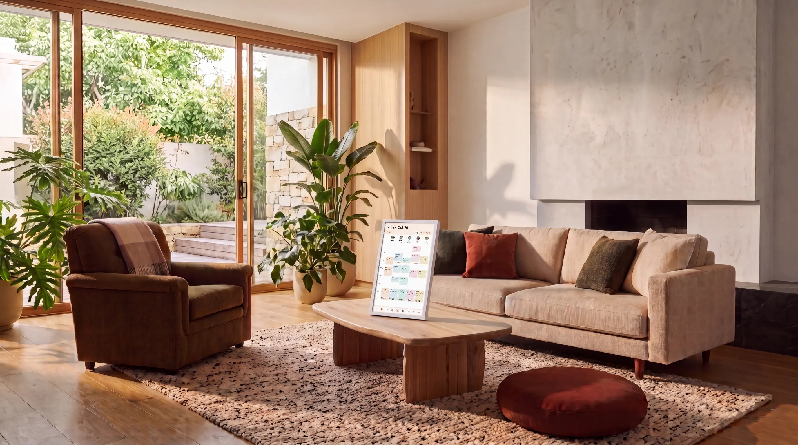 A calm, tidy living room with the Kora display showing the family's day on the coffee table